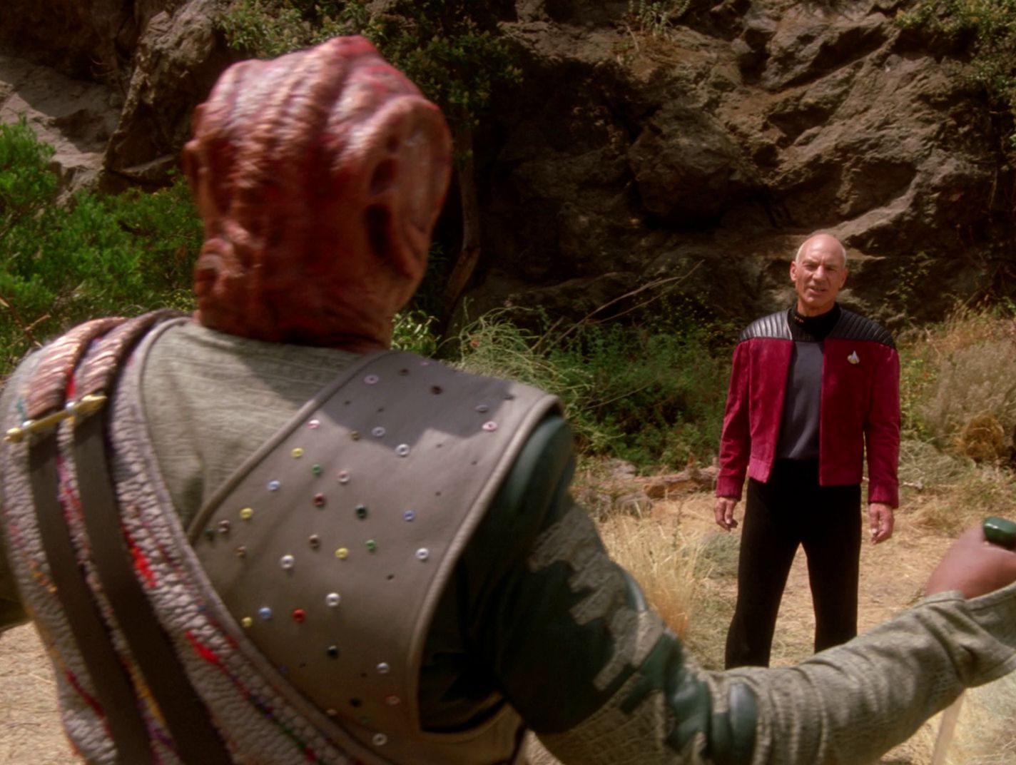 Tamarian captain and Picard on the surface on the planet.