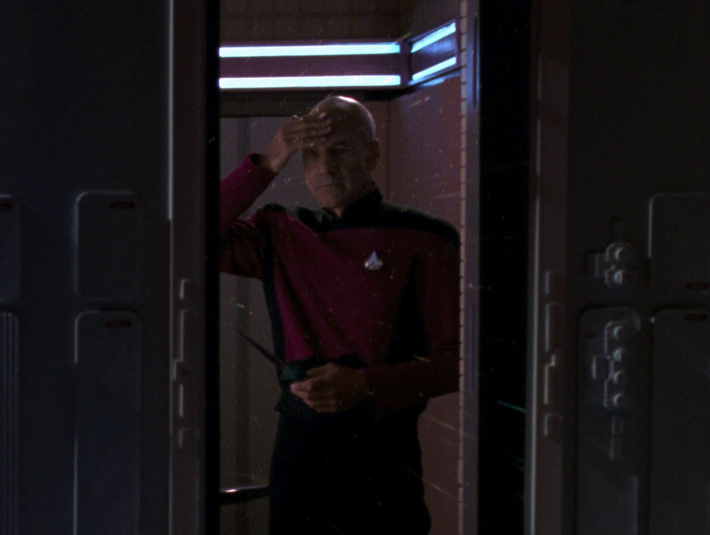 Picard performs the Tamarian salute at his window, in honor and memory.